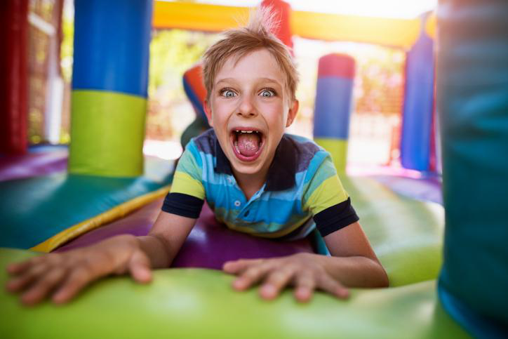 young boy in a bounce house