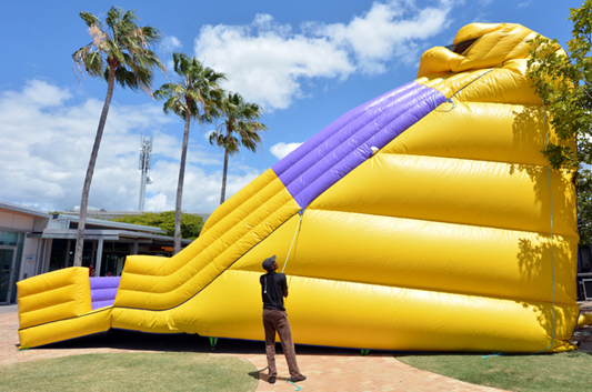 person standing next to bouncy slider